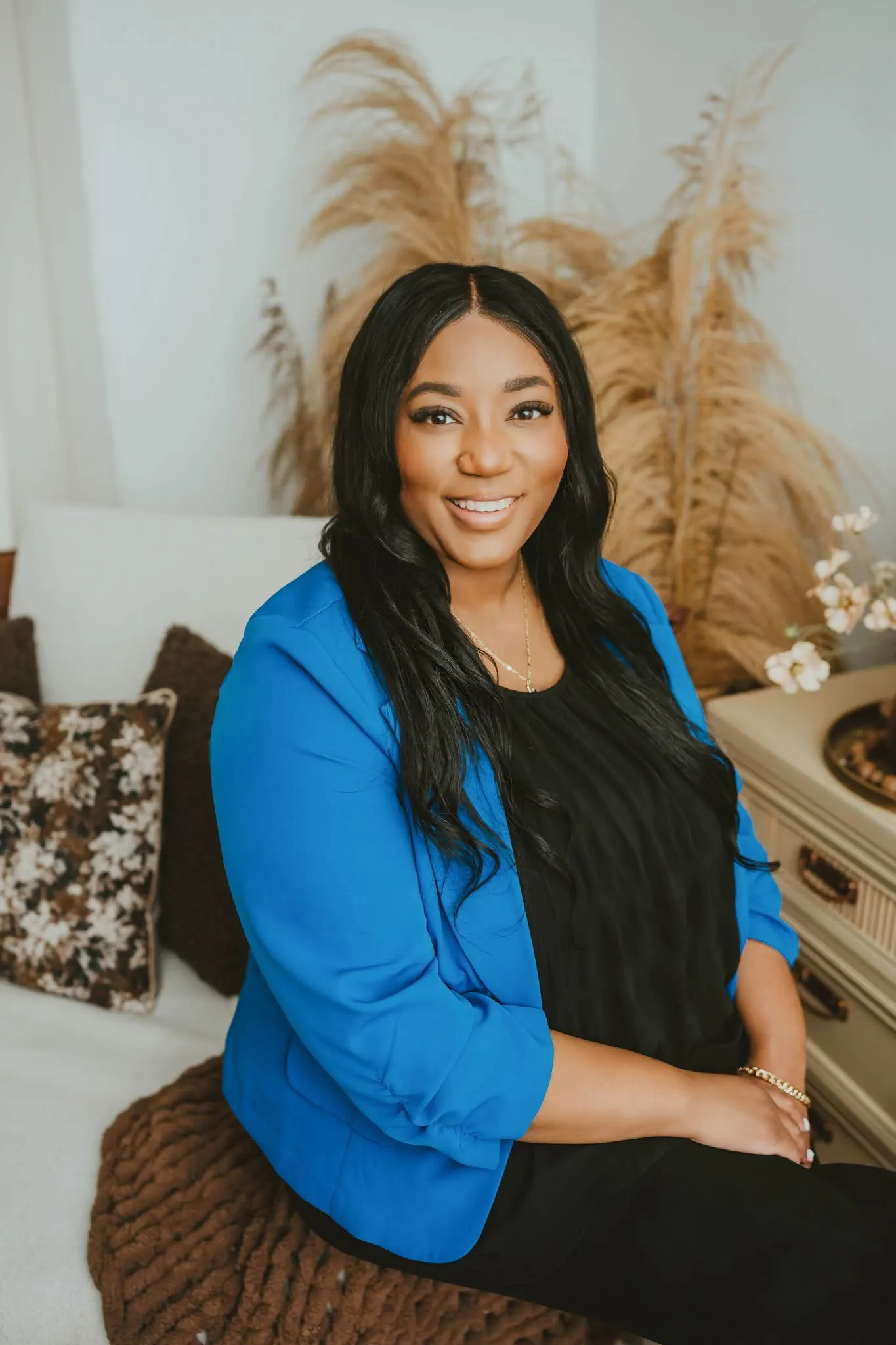 Bree Patterson, LCSW, sitting and smiling warmly